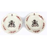 A pair of 18th century creamware plates with crimped rims, painted foliate detail and central