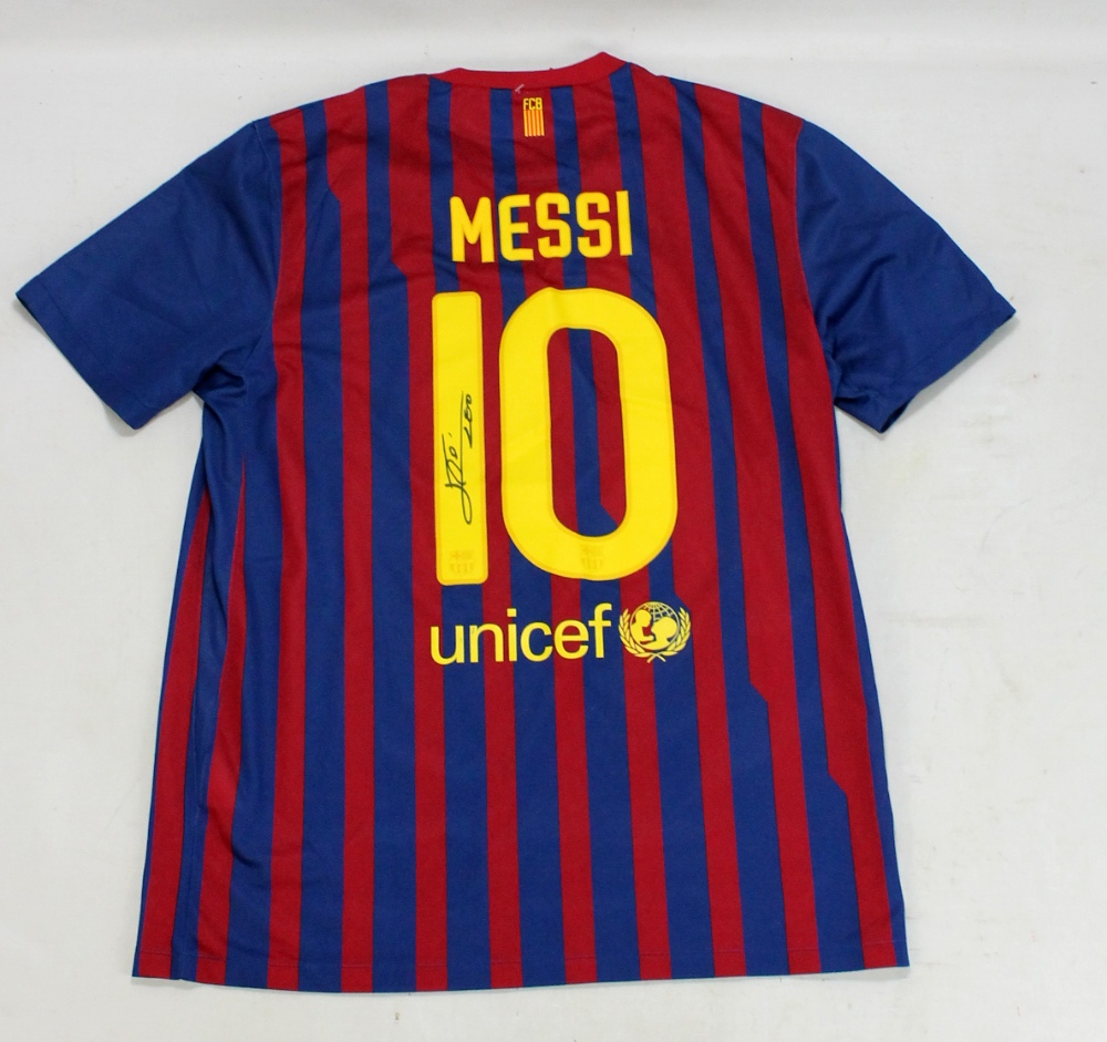 LIONEL MESSI; a signed replica Barcelona football shirt.