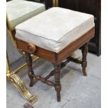 An Edwardian adjustable piano stool.