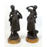 AFTER AUGUSTE MOREAU; a pair of bronze figures of girls with baskets, each signed to base, raised on
