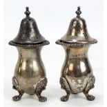 A pair of George VI hallmarked silver salt and pepper pots each inscribed 'Salt' and 'Pepper',