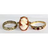 A yellow metal, diamond and ruby five stone ring (hallmark illegible), size R, a cameo ring, and