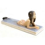 ROYAL COPENHAGEN; a figure modelled as a mermaid, painted and printed marks to base, length 20cm.