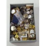 A quantity of pocket watch movements, white enamel dials, component parts etc, some near complete