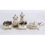 OLDFIELDS LTD; a George V hallmarked silver part cruet set comprising two salts (lacking liners) and
