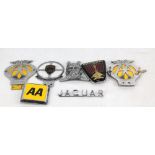Two AA car badges and a later example, a Jaguar Drivers Saxon' Club mascot and a Jaguar badge, a