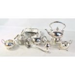 A small group of electroplated items comprising a four piece tea set including a spirit kettle on