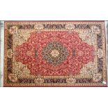 A red ground Keshan carpet, 230 x 160cm.