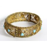 A Portuguese 833 grade silver gilt filigree bangle inset with turquoise hearts, hallmarked for