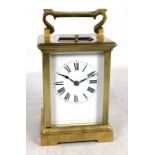 A brass cased repeating carriage clock, the circular dial set with Arabic numerals, numbered 62992