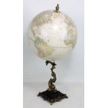 A modern globe by The George F Cram Co, on stylised fish base, height 58cm.