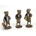 Three early 20th century painted lead nodding bulldog figures, height of each 6.5cm (3).