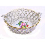 HEREND; an early 20th century floral and gilt decorated pierced basket with intertwined twin