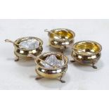 JOSIAH WILLIAMS & CO; a cased set of four George V hallmarked silver open salts with gadrooned rims,