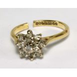 An 18ct yellow gold and white stone cluster ring, approx 3.9g (af, cut).Additional InformationThe