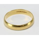 An 18ct yellow gold wedding band, size T, approx 3.9g.