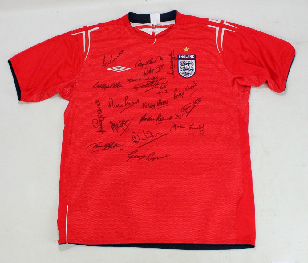 ENGLAND; a multi-signed replica away shirt with Bonetti, B. Charlton, Carragher, Springett, Cohen,