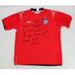 ENGLAND; a multi-signed replica away shirt with Bonetti, B. Charlton, Carragher, Springett, Cohen,