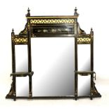 A late 19th century Aesthetic Movement ebonised painted and gilded overmantel mirror, width 120cm.