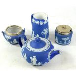 WEDGWOOD; four pieces of blue jasper dip ware comprising a teapot, length 22cm, a twin handled