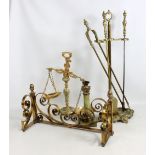 A brass companion set, fire front, pair of glass and onyx scales and similar single candlestick.