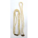 A seed pearl graduated three strand choker with silver marcasite set clasp, and a further similar