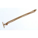 A 9ct yellow gold curb link pocket watch chain suspending a T-bar, length 39cm, approx 22g.