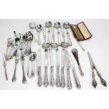 A collection of silver flatware including a set of seven Fiddle pattern teaspoons, a set of five Old