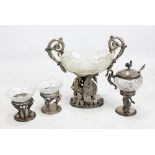 A pair of pre-1886 German silver and clear cut glass salts raised on stylised swan supports,