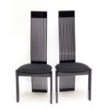 KESTERPORT; two contemporary black chairs with pierced backs and black upholstered seats (2).