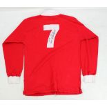 ERIC CANTONA; a signed replica 1970s Manchester United football shirt.