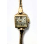 LONGINES; a lady's vintage 9ct yellow gold wristwatch with integral bracelet, approx 15.8g.