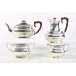 ROBERTS & BELK; a George VI hallmarked silver four piece tea set comprising a teapot of rounded