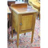 A mahogany and inlaid single door pot cupboard raised on square sectioned tapering legs, width 40.