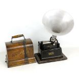 An Edison 'Gem' phonograph with domed oak case and simple tin horn (af).Additional InformationNo