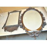 A fretwork mahogany wall mirror and a modern decorative oval wall mirror (2).