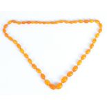 A graduated amber bead necklace, length 74cm, approx 45.2g.