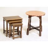 A nest of occasional tables and a copper top table.