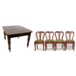 A set of four Victorian mahogany dining chairs with padded drop-in seats and ring turned front