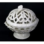 WEDGWOOD; a creamware orange bowl and cover with pierced garland and foliate scroll decorated sides,