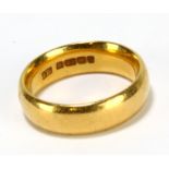 A 22ct yellow gold wedding band, size J1/2, approx 7.5g.