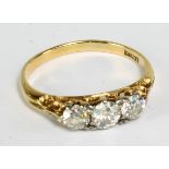 An 18ct yellow gold and three stone diamond ring, the largest weighing approx 0.15ct, size N, approx