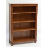 A 20th century oak four shelf open bookcase, width 97.5cm.