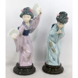 LLADRO; two figures of geisha, the larger holding two fans and the smaller bowing, height of