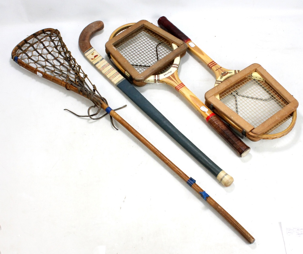 Two vintage Dunlop 'Maxply' tennis rackets, lacrosse and hockey sticks (4).