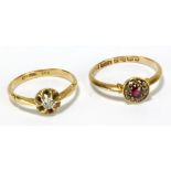 An early 20th century 18ct yellow gold ring, with central ruby coloured stone within a band of melee
