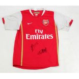 DENNIS BERGKAMP AND THIERRY HENRY; a signed replica Arsenal football shirt.