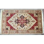 A beige ground Heriz carpet, 230 x 160cm.