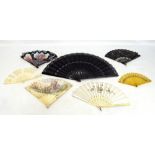 A group of fans to include a sequin decorated silk example with ebonised white metal inset sticks,