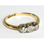 A yellow metal and diamond three stone ring stamped '18ct & PT' to band interior, size I, approx 2.